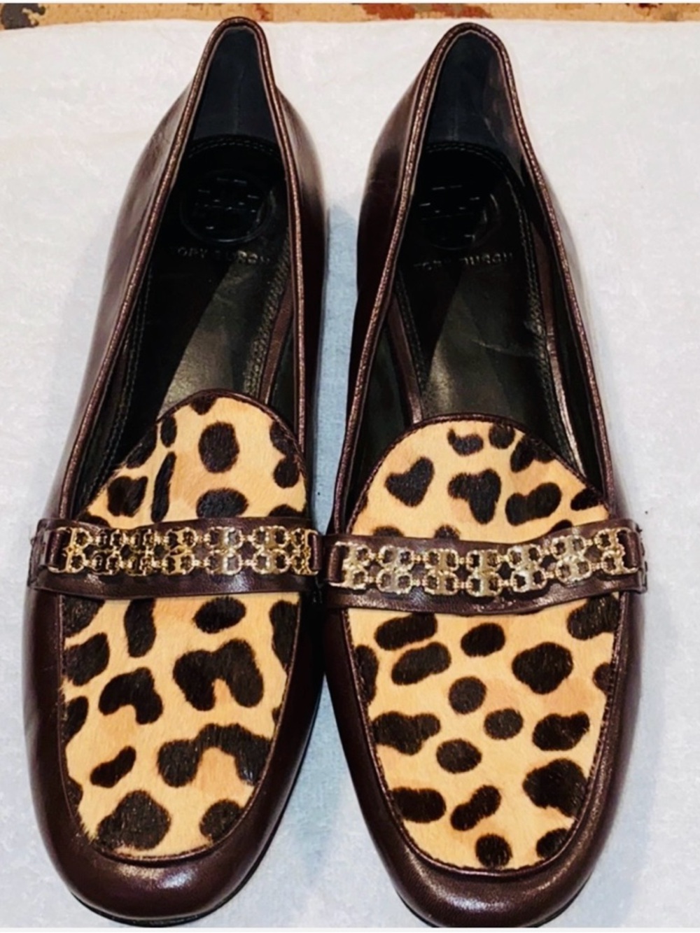 Tory Burch loafer style with faux leopard accents